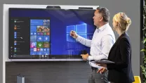 Two people using a Windows Collaboration Display 