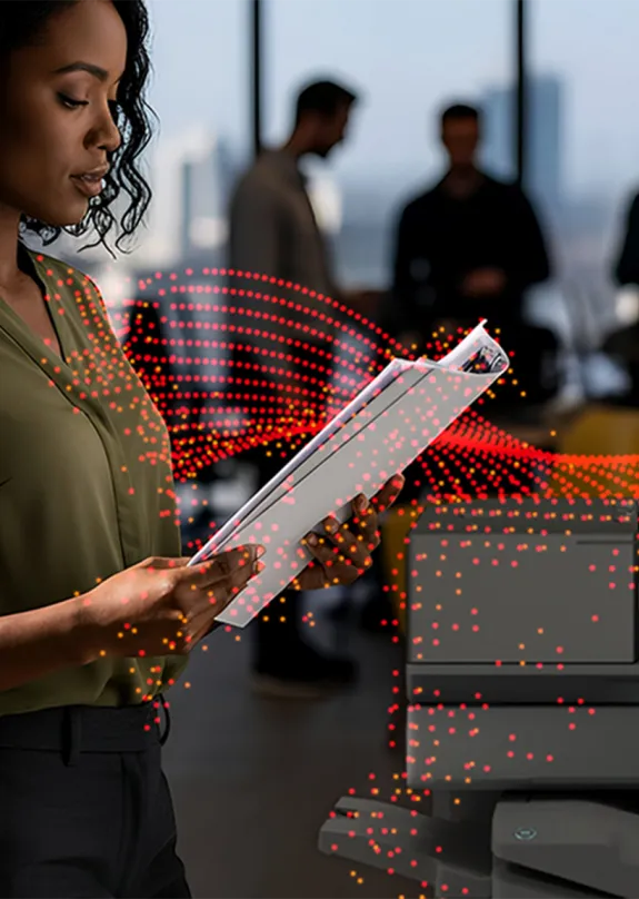 Woman using Sharp A3 MFP in an office space